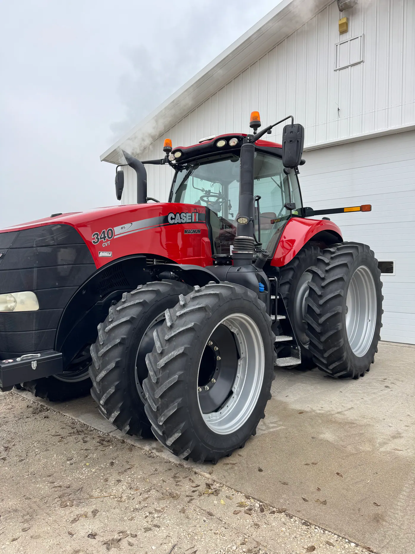 Red Case IH tractor with dual front and rear wheels