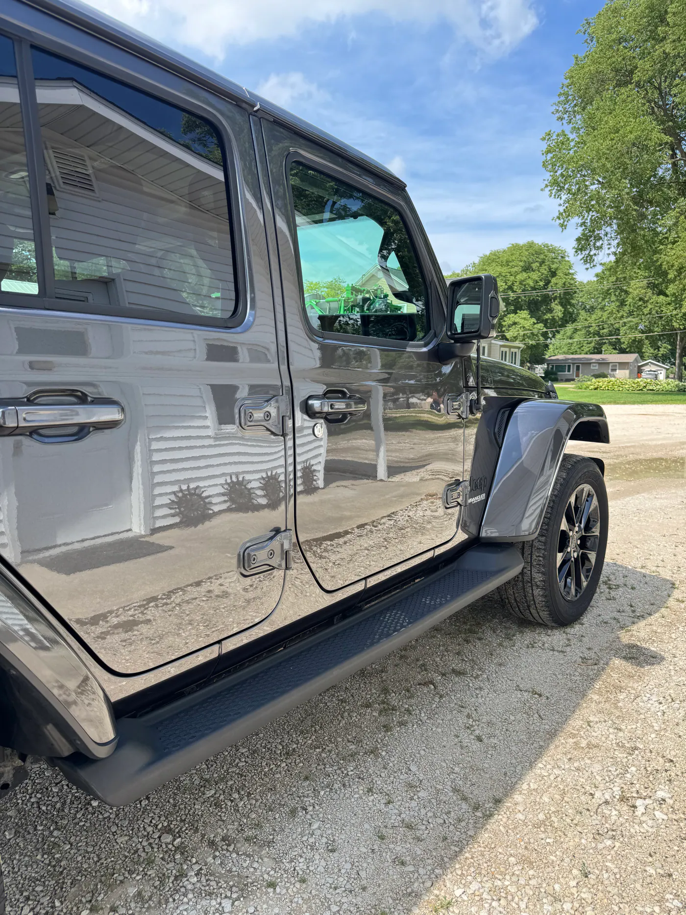 Reflective gray Jeep body panels photographed outdoors